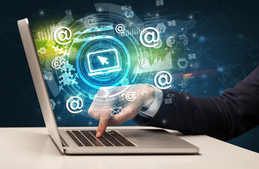 Business hand typing on a modern laptop