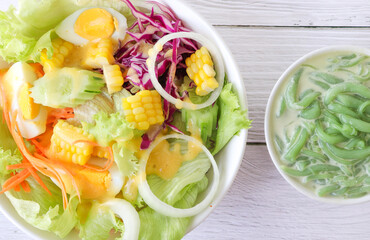 Top view of fresh salad with Lod Chongdessert on gray wooden table.