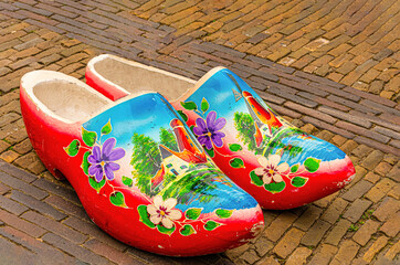 traditional multicolored clogs on a street in the historic center of the city of Breda. Netherlands. - 482179574