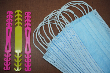 Blue medical masks are usually used by women to protect themselves from the corona virus covid 19 during the pandemic.