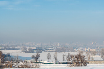 View of the city in winter. Air pollution from smog