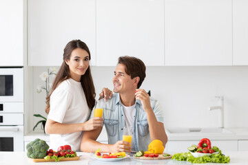 Young couple at the breakfast kitchen eating healthy food