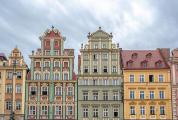 Fototapeta na wymiar Colorful town houses buildings at Market Square (Rynek Square) - Wroclaw, Poland