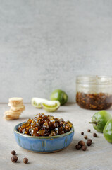 Tomato jam from green tomatoes with allspice and fresh ginger ingredients.