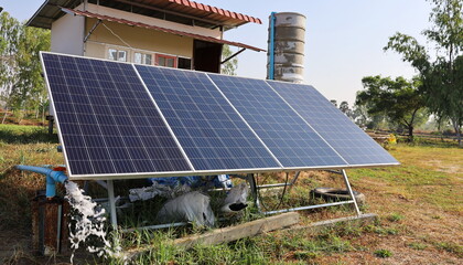 Clean solar panels pumping water. Photovoltaic cells produce clean energy from the sun for pumping...