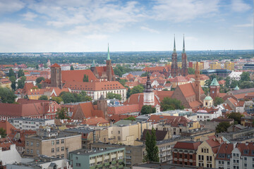 Fototapeta na wymiar Aerial view of Cathedral Island (Ostrow Tumski) with Collegiate Church of the Holy Cross, Cathedral of St. John the Baptist and Church of St Mary on the Sand - Wroclaw, Poland