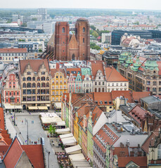 Fototapeta na wymiar Aerial view of St Mary Magdalene Church and Market Square colorful buildings - Wroclaw, Poland