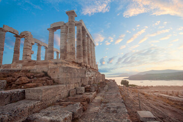 Temple of Poseidon at Cape Sounio with amazing sky clouds, Attica, Greece