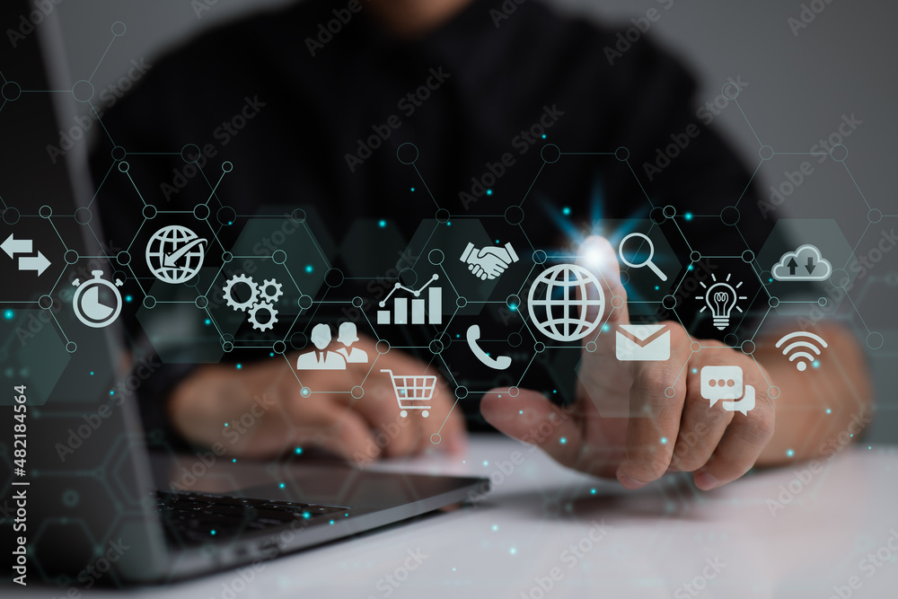 Poster Businessman is using a digital vitual screen with laptop computer. The concept of global business.
