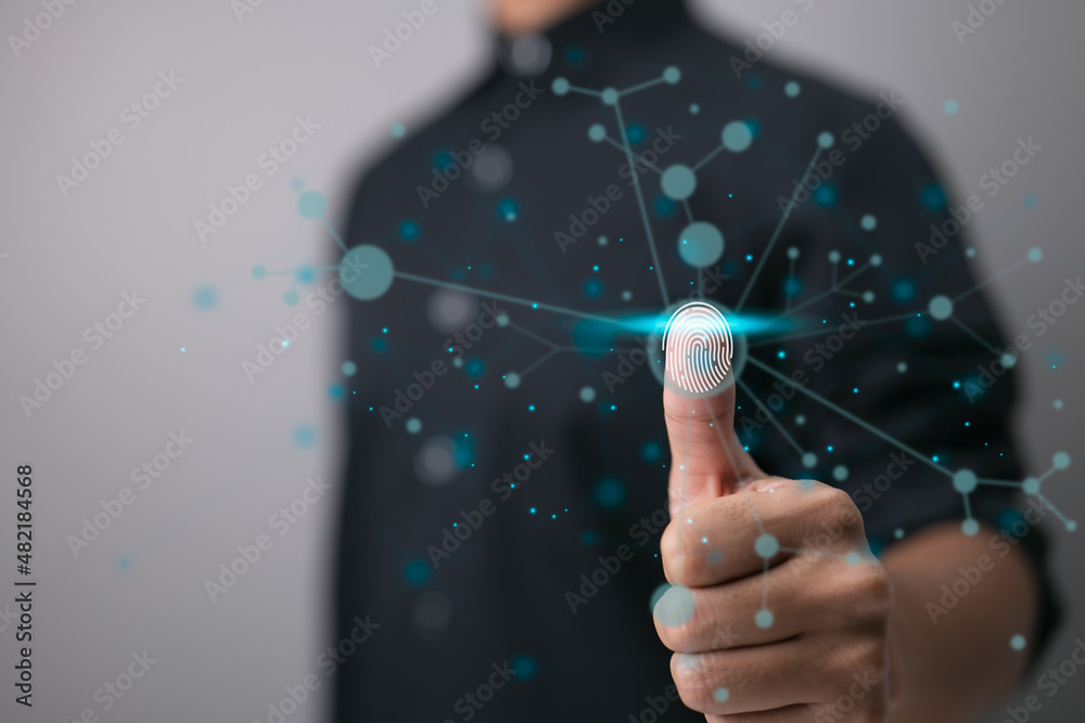 Aufkleber The use of fingerprint scanning technology allows a businessperson to log in. The use of a fingerprint to identify a person and the notion of a security system.