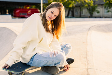 Young female skateboarder at skate park