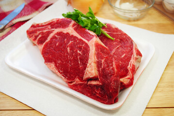 Two Raw Prime Rib Steaks Ready to be Prepared