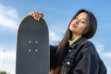 Young female skateboarder at skate park