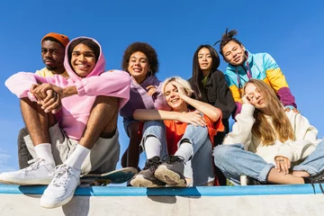 Fotobehang Multiracial group of young friends bonding outdoors © oneinchpunch