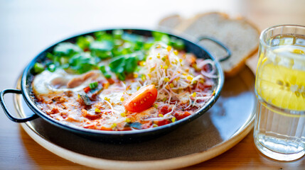 Egg shakshouka dish on a restaurant table