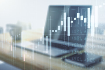 Multi exposure of abstract financial graph and modern desktop with pc on background, financial and trading concept