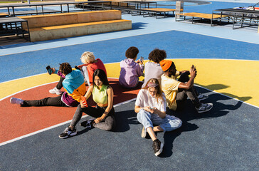 Multiracial group of young friends bonding outdoors