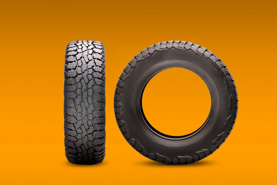 new all-season at tires on an orange background side and front view. wheels for SUVs