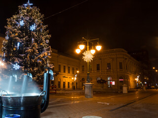 Fototapeta premium Boiling mulled wine and Christmas tree at Szeged centre