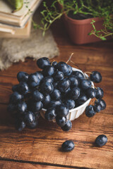 Close Up of Black Grapes in a Vintage Bowl