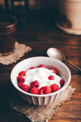 Bowl of Summer Dessert with Raspberry and Cream