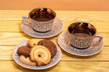 cups of coffee and cookies