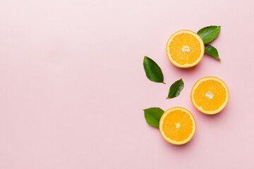 fresh Fruit orange slices on colored background. Top view. Copy Space. creative summer concept. Half of citrus in minimal flat lay with copy space