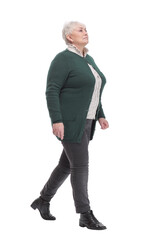 Portrait of happy businesswoman walking on white background