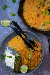 Vegetarian Mexican rice, skillet corn cake, cream, pickles