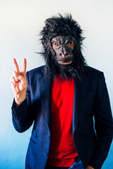 Man in a suit and with a gorilla mask.