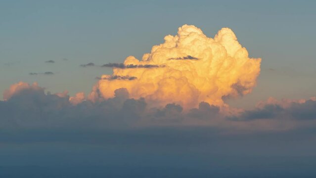Zoom out of big cumulus clouds looking like explosion in the sky above the city, Clouds evolution atmospheric, sky clouds time lapse, time lapse of sunset clouds forming on the evening sky