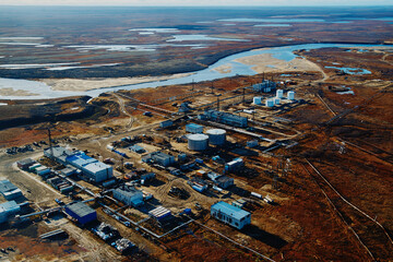 Extraction of natural gas. Mining. Industrial village in the tundra. View from above