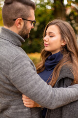 Fototapeta premium Happy young european married couple portrait in fall