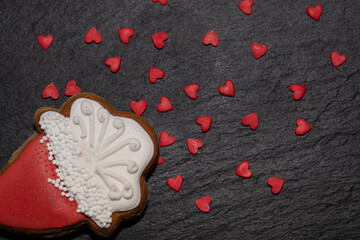 Red sweet hearts and festive cookies on a black background.Festive food background - 482200930