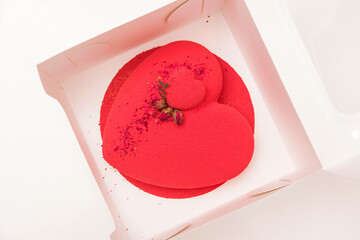 Luxury mousse cake decorated with roses. Valentine's Day celebration. Love. Birthday romantic cake.