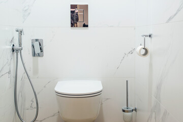 Toilet bowl in modern bathroom interior. Modern toilet interior, front view.