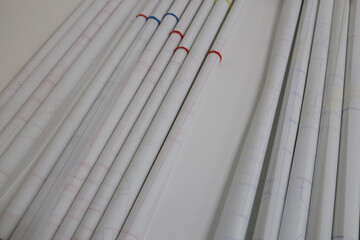 Rolls of tracing paper with drawings drawn on a plotter