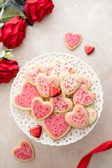 Obraz na płótnie Canvas Heart cookies. Homemade butter cookies with pink glaze and sprinkles.