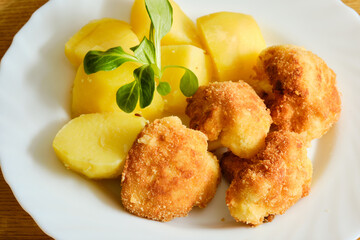 Cauliflower with potatoes on plate