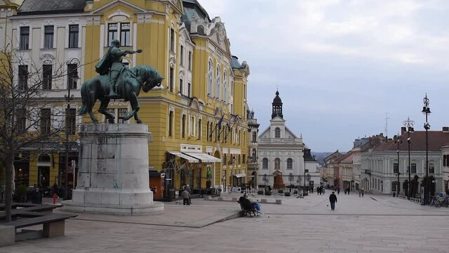 Hunyadi Statue, City assembly building and Saint Sebastian's catholic Church on Szechenyi square in Pecs Hungary Europe