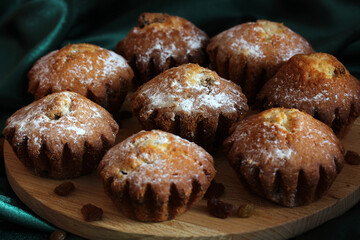 Cupcakes with raisins, sweet flour product. treats.