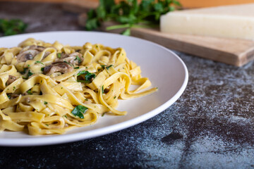 Italian fettuccine pasta with porcini mushrooms. Creamy Italian pasta, suitable for those who follow a vegetarian diet.