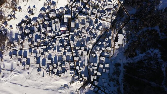 Aerial overhead drone footage of the Saas-Fee traditional village and ski resort in the alps in Canton Valais in Switzerland