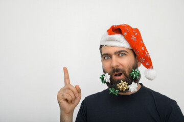 Bearded Santa Claus with Christmas decorations on an isolated background. Emotion.