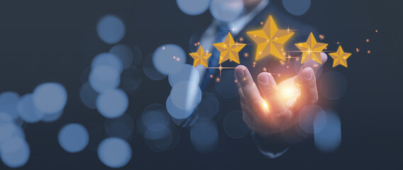 Customer review, satisfaction, service business, feedback survey concept. Businessman holding 5 stars on hands. Customers satisfaction, give service ranking on a digital online application.