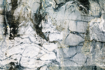 Marble quarry, marble rocks in the wild. Natural stone. Ancient marble quarry, marble rocks in the wild. Pieces of marble mountain. Tourism and travel