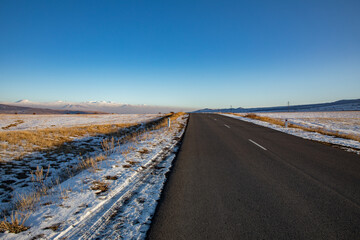 winter landscape and asphalt road