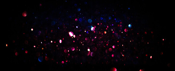 background of abstract glitter lights. purple and blue.