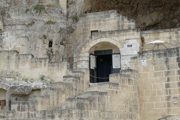 facade of the rupestrian house museum excavated inside the rock  of Sasso Caveoso in Matera