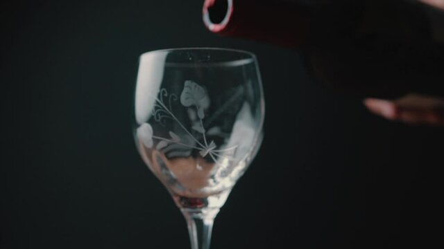 Filling a wine glass in slow motion 